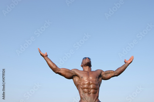 Strong bodybuilder man with perfect abs,biceps, chest