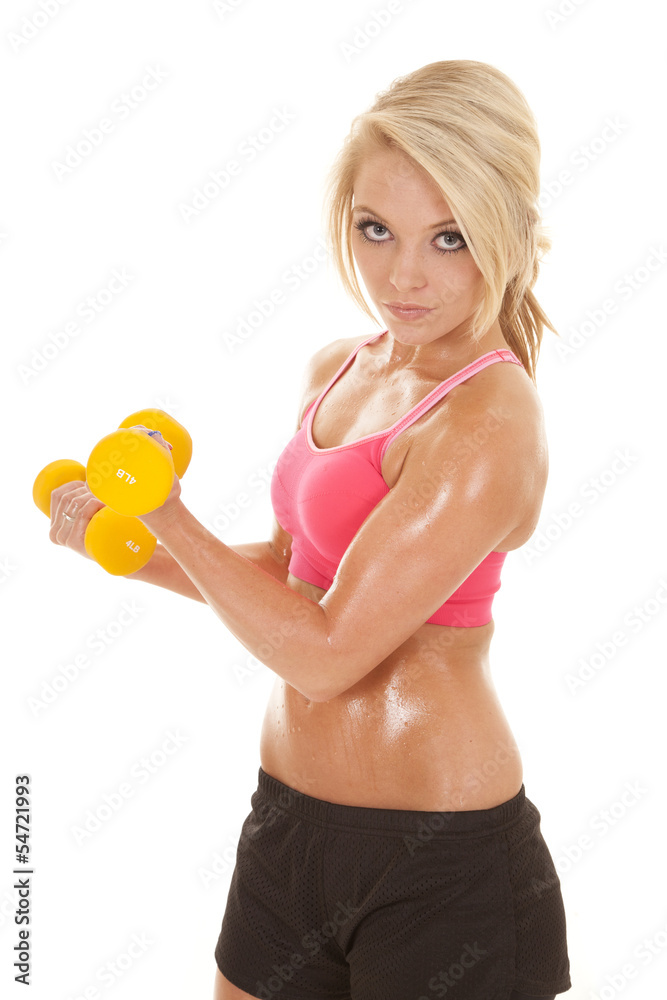 woman pink sports bra yellow weights side curl look
