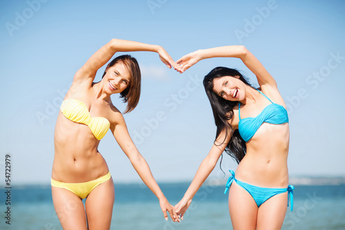 girls having fun on the beach