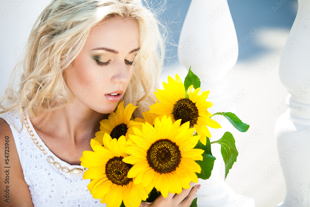 portrait of attractive woman with sunflowers in her hand portrait of attractive woman with sunflowers in her hand