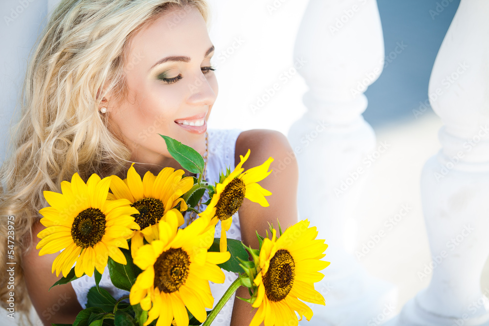 portrait of attractive woman with sunflowers in her hand portrait of attractive woman with sunflowers in her hand