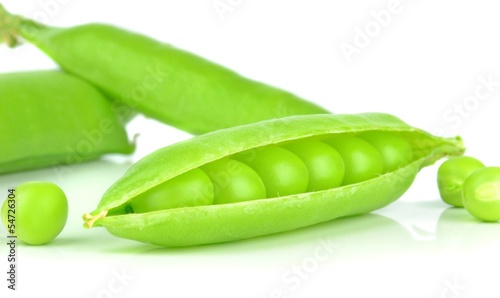 Fresh peas in a pod on a white background