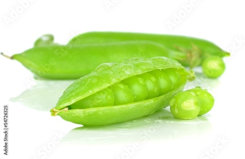 Fresh wet peas in a pod on a white background