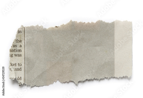 Grey piece of torn ripped paper isolated on white background photo