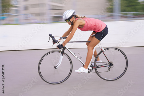 portrait of speedy biker woman in motion