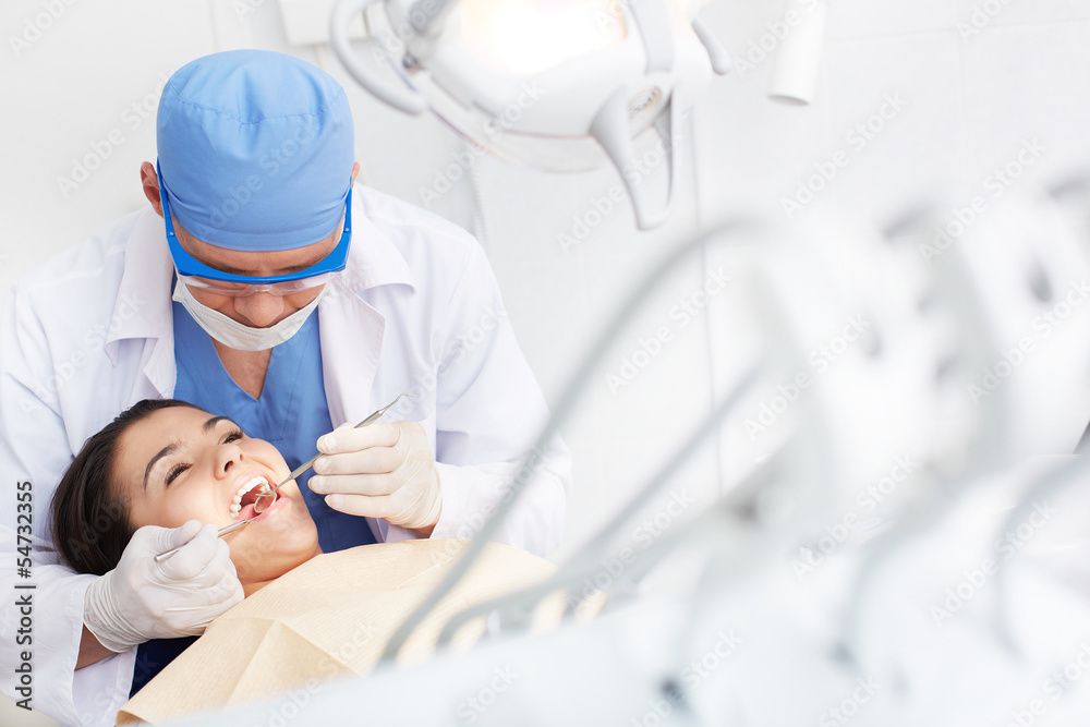 Examining teeth Examining teeth