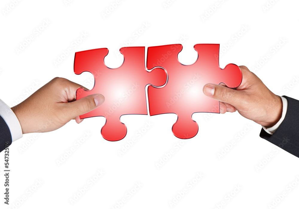 Business hands and puzzle on white Business hands and puzzle on white