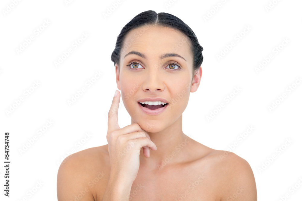 Astonished nude model posing finger on her cheek Astonished nude model posing finger on her cheek