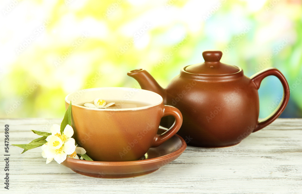 Cup of tea with jasmine, on bright background Cup of tea with jasmine, on bright background