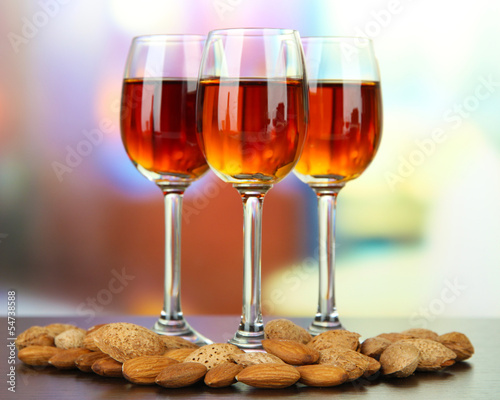 Glasses of amaretto liquor and roasted almonds,