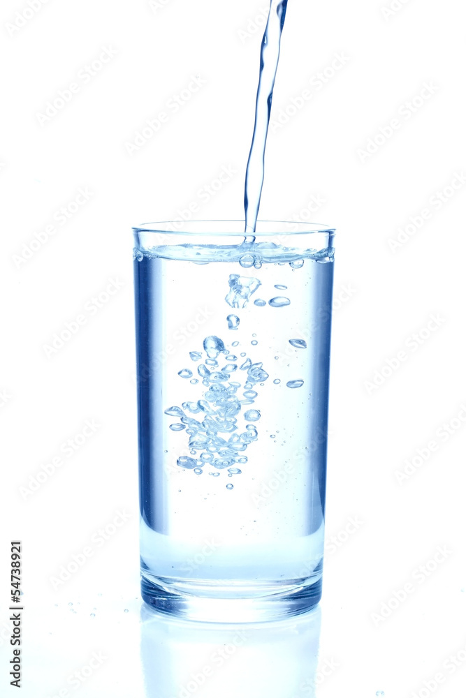 Fresh water pouring in a glass on white background. Fresh water pouring in a glass on white background.