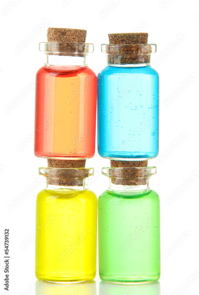 Bottles with colored liquids isolated on white Bottles with colored liquids isolated on white