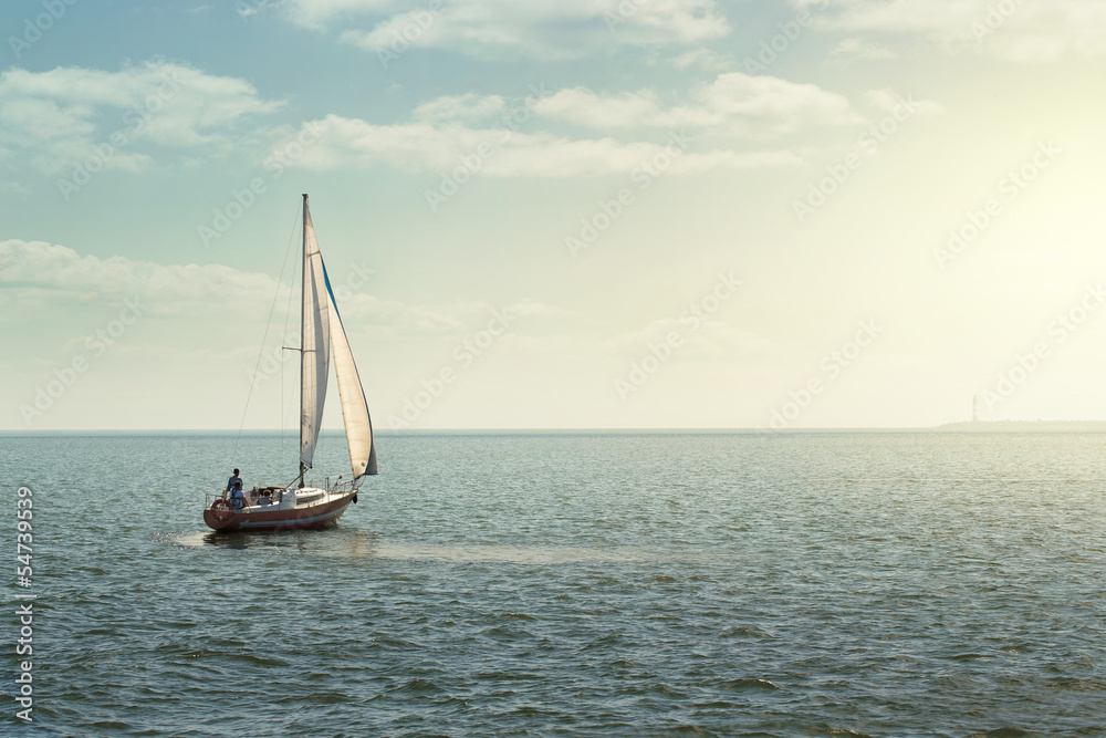 Sailing boat at the open sea with copy space
