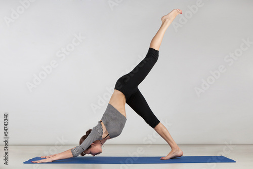 Young woman exercising yoga