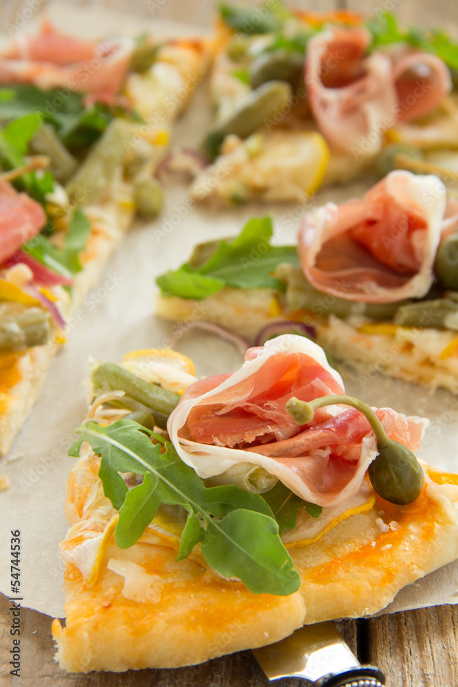 Pizza with arugula and prosciutto. Pizza with arugula and prosciutto.