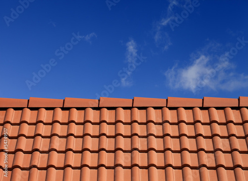 Roof tiles against blue sky