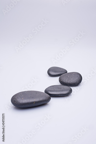 massage stones on white background