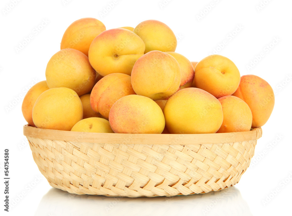 Fresh natural apricot in wicker basket isolated on white Fresh natural apricot in wicker basket isolated on white