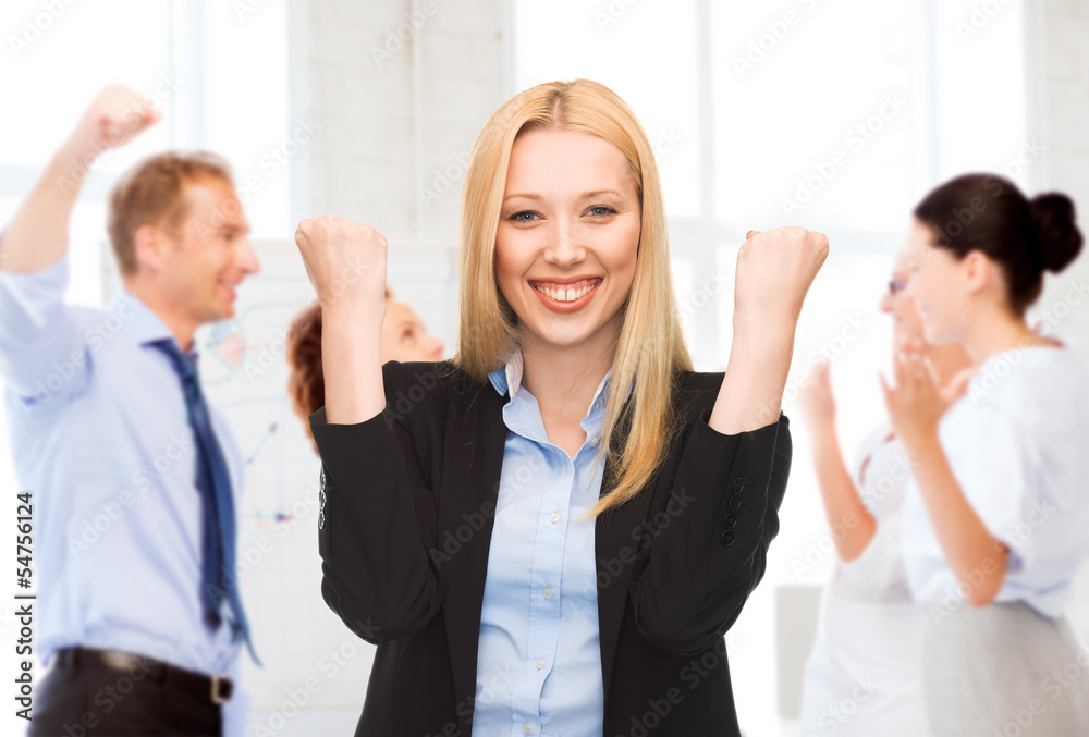 businesswoman celebrating succes in office businesswoman celebrating succes in office