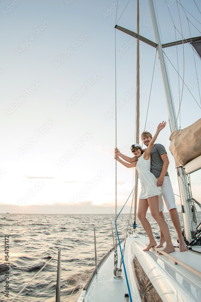 Fototapeta premium Happy young couple relaxing on a yacht