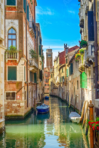 Venice cityscape, water canal, church and buildings. Italy