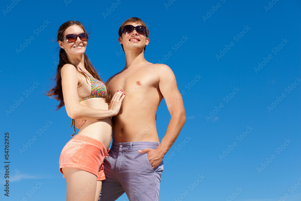 Happy Young Couple Together On The Beach Happy Young Couple Together On The Beach