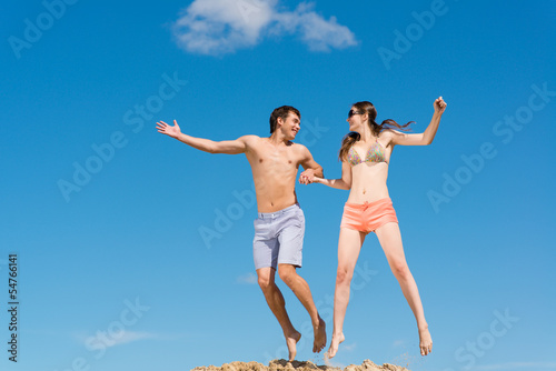couple jumping together