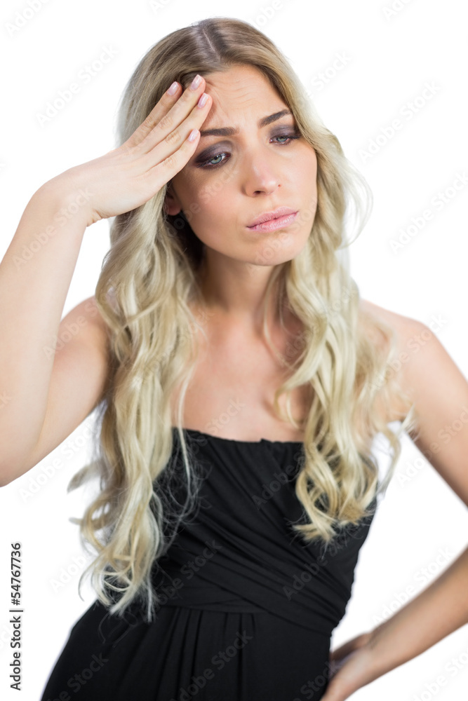 Gorgeous blonde wearing black dress having a headache