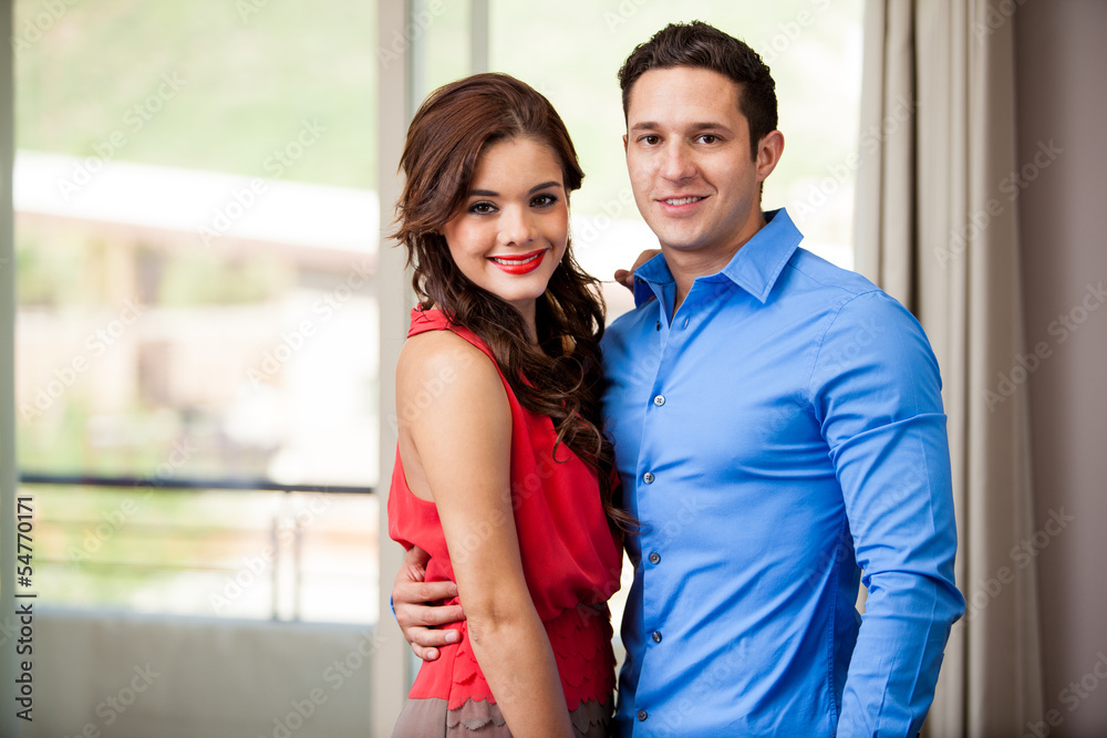 Fototapeta premium Elegant young couple in a bedroom