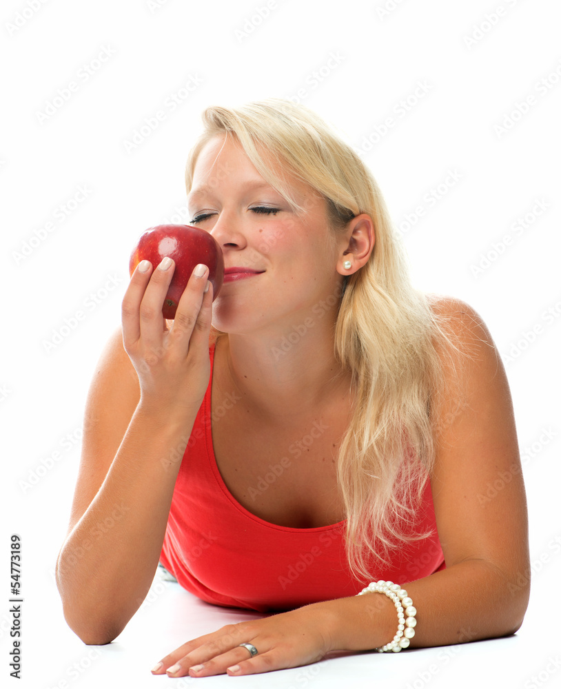 Frau riecht an einem Apfel Frau riecht an einem Apfel