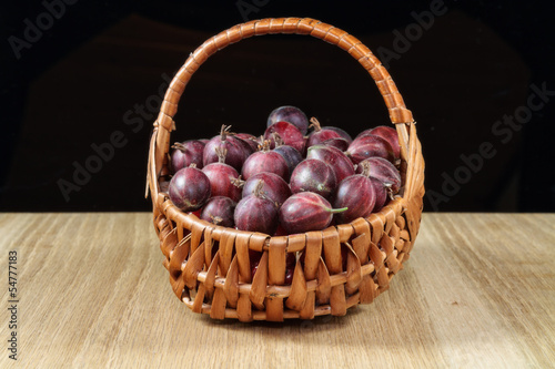 Gooseberries in a wickerwork plaited basket