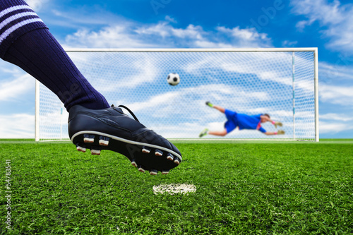 foot shooting soccer ball to goal, penalty