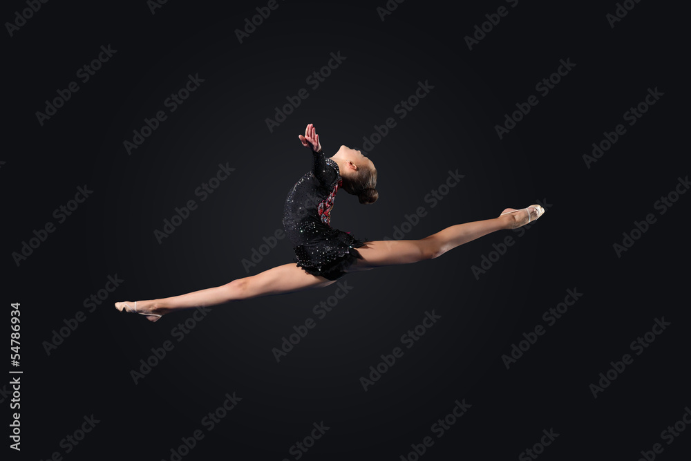 Young woman in gymnast suit posing