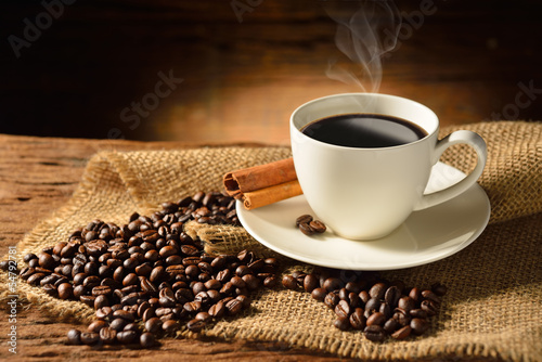 Coffee cup and coffee beans on old wooden background #54792781