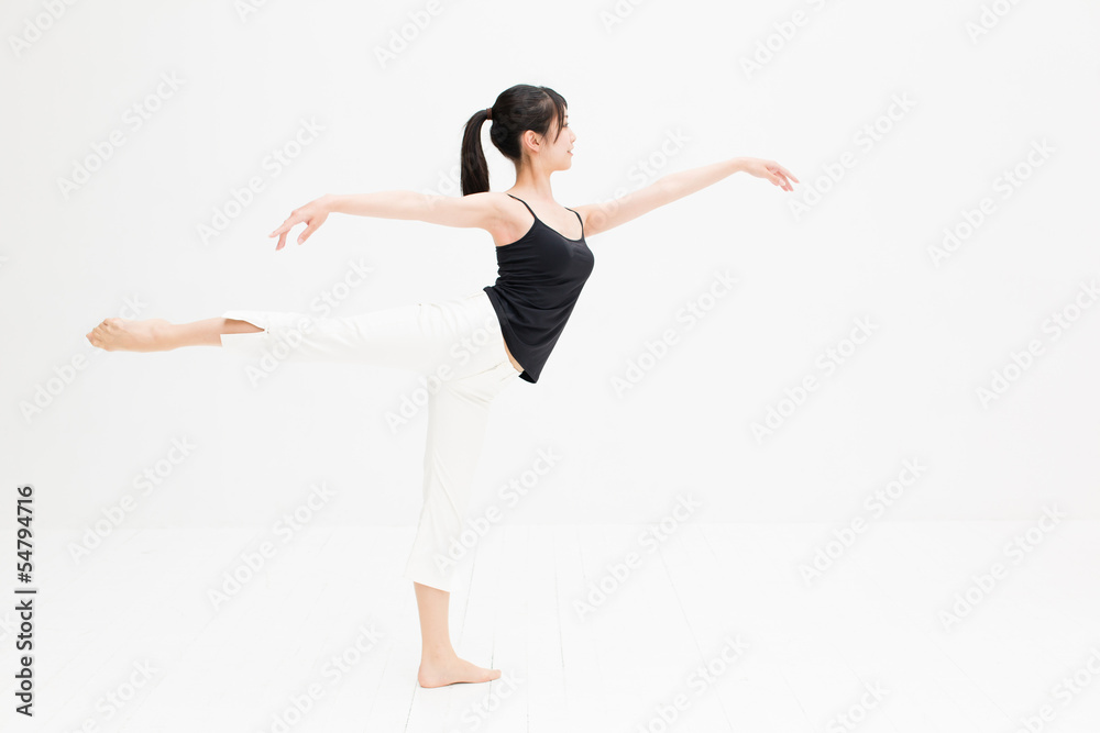 attractive asian woman exercising on white background