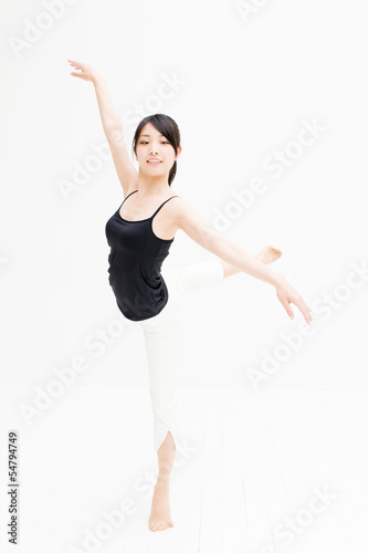 attractive asian woman exercising on white background