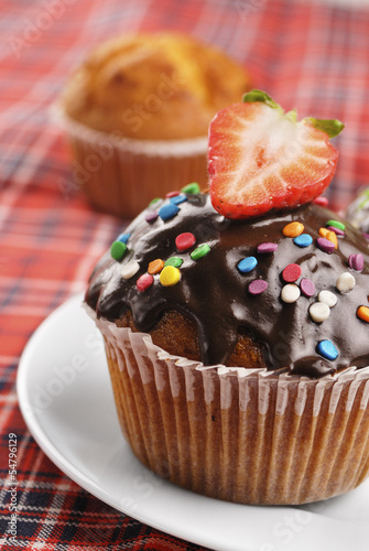 Chocolate muffin with sprinkles