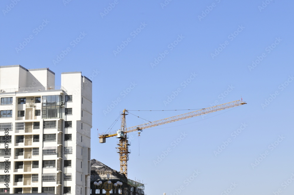 Modern buildings in the construction and the blue sky Modern buildings in the construction and the blue sky