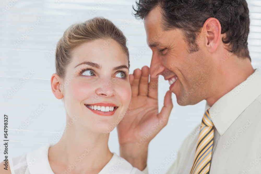 Employee telling secret to his colleague Employee telling secret to his colleague