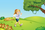 A girl jogging at the hill