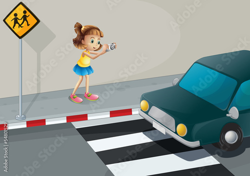 A girl taking a photo of the car