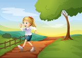 A young woman running in the hill