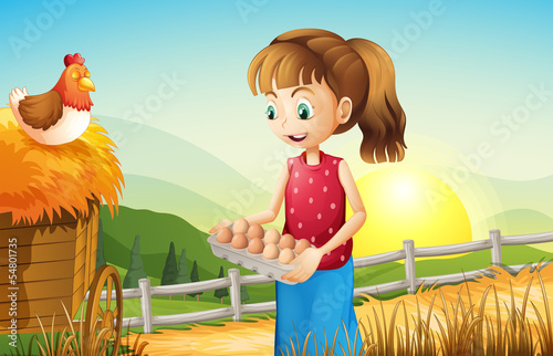A young girl holding an egg tray