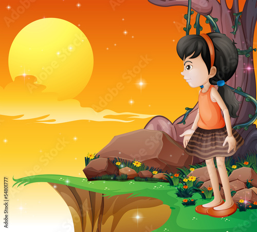 A young girl watching the fullmoon at the cliff