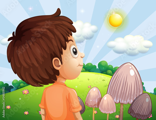 A boy looking at the sun