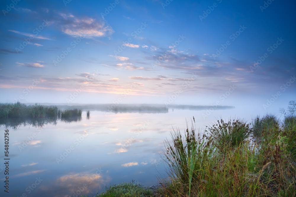 calm misty morning over lake