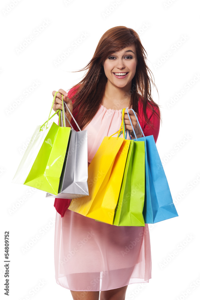 Fashionable young woman with shopping bags