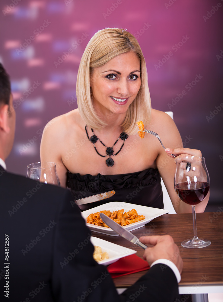 Couple Having Dinner At Restaurant Couple Having Dinner At Restaurant