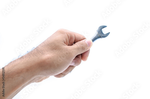 Hand with a new wrench isolated on white