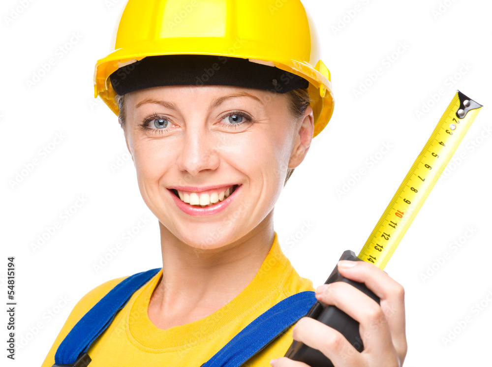 Young construction worker with tape measure Young construction worker with tape measure